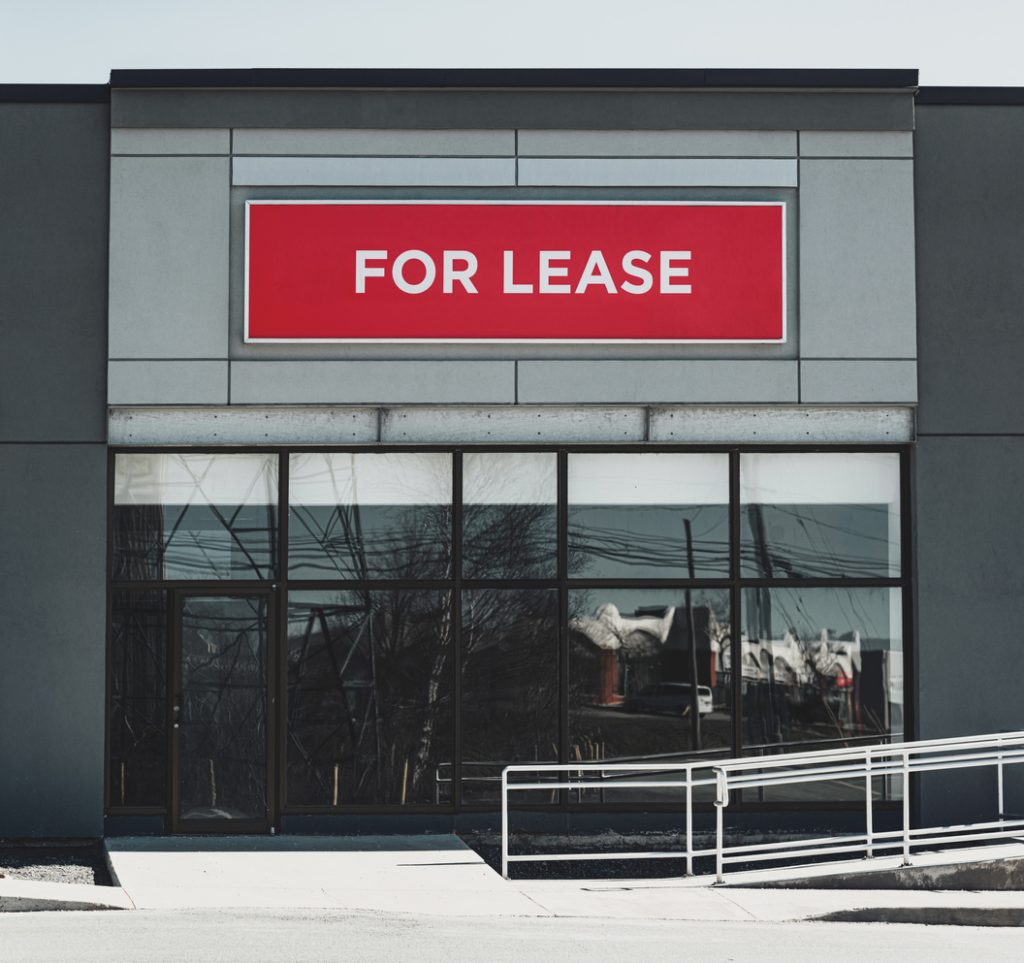 commercial-real-estate-with-for-lease-sign-above-doors